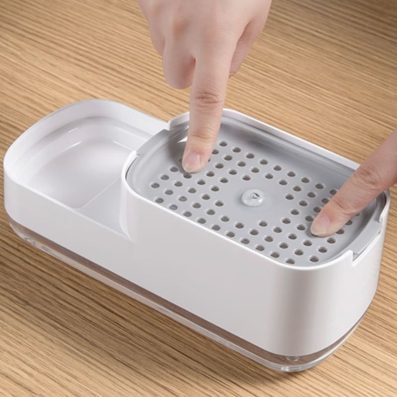 Wasmiddel dispenser en sponshouder voor gootsteen